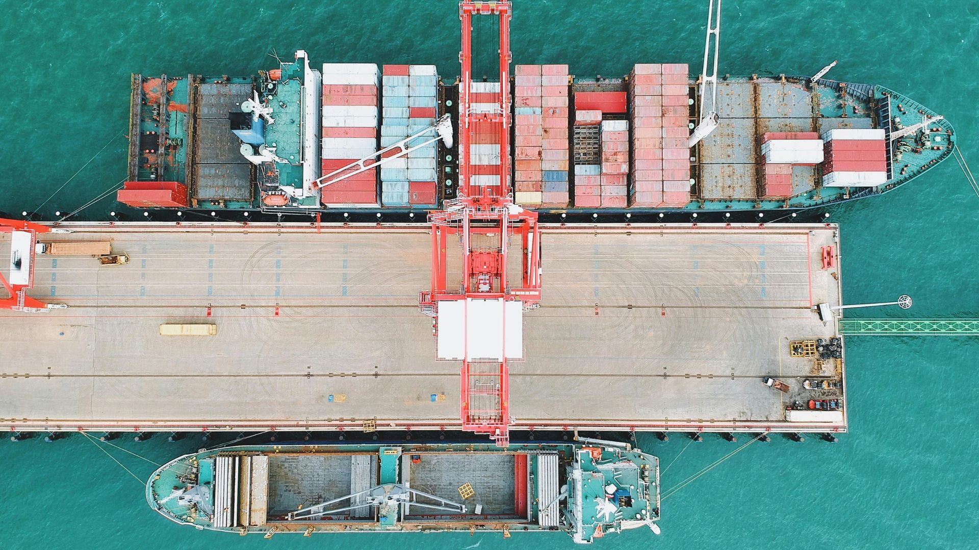 Cargo ship containers docked on a pier